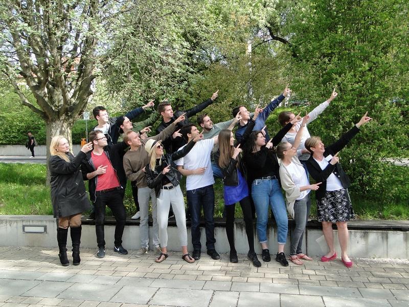 a group of people pointing at something