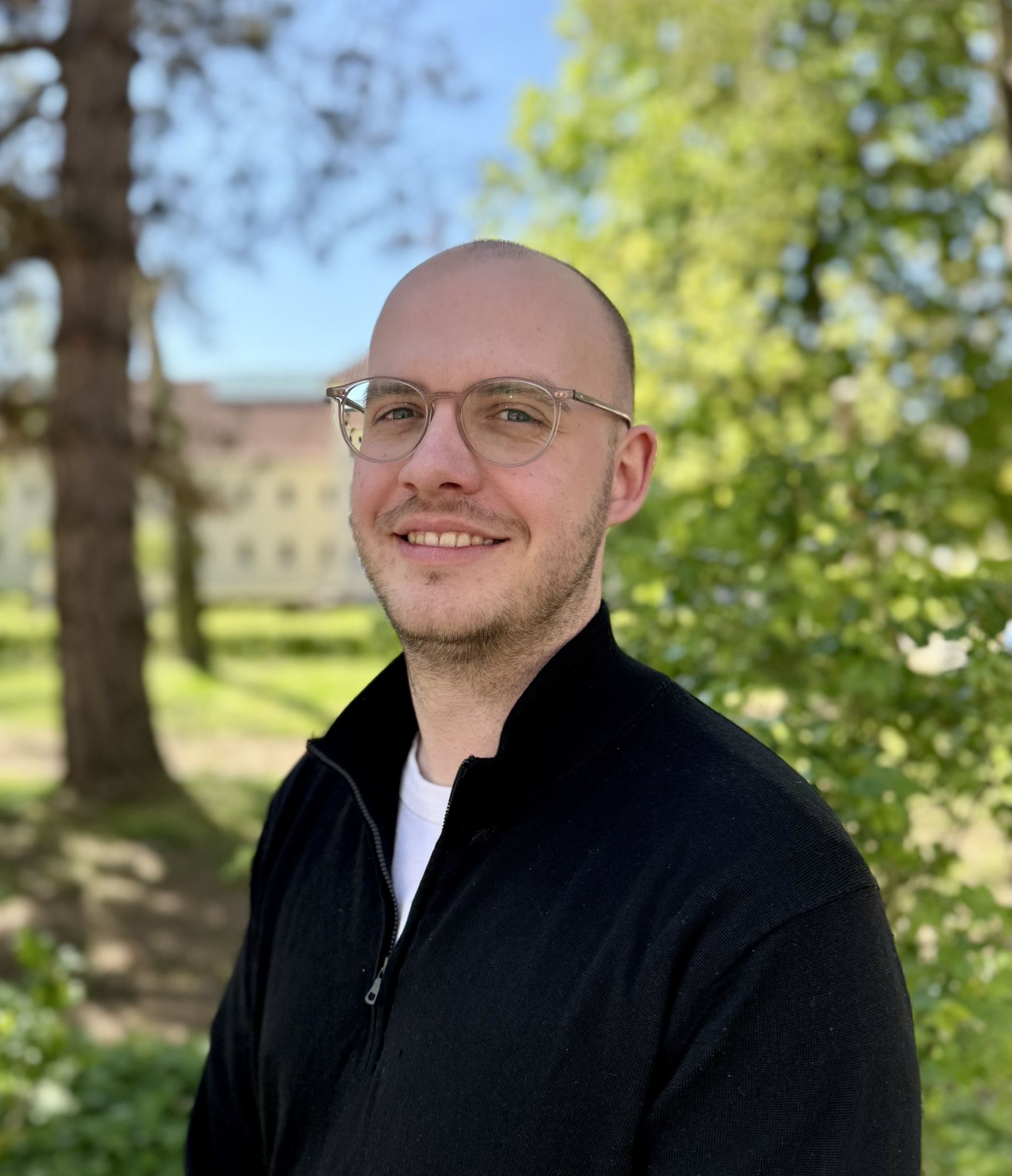 Man with glasses outdoors