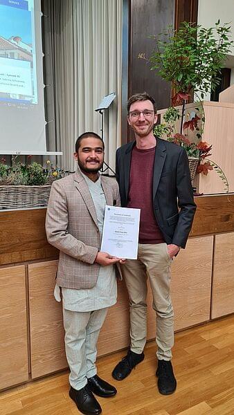 Pascal Leibrand and student with certificate