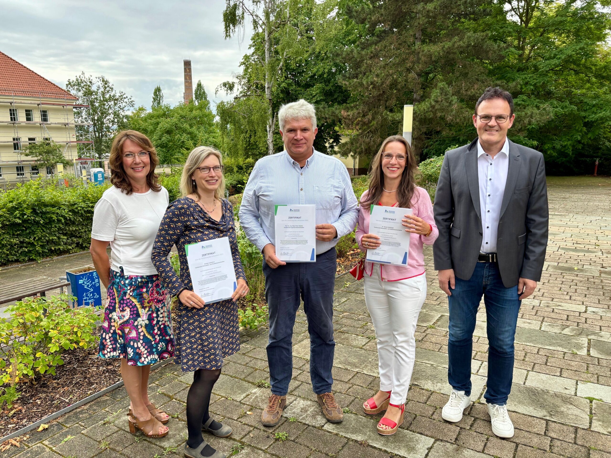a group of people holding papers
