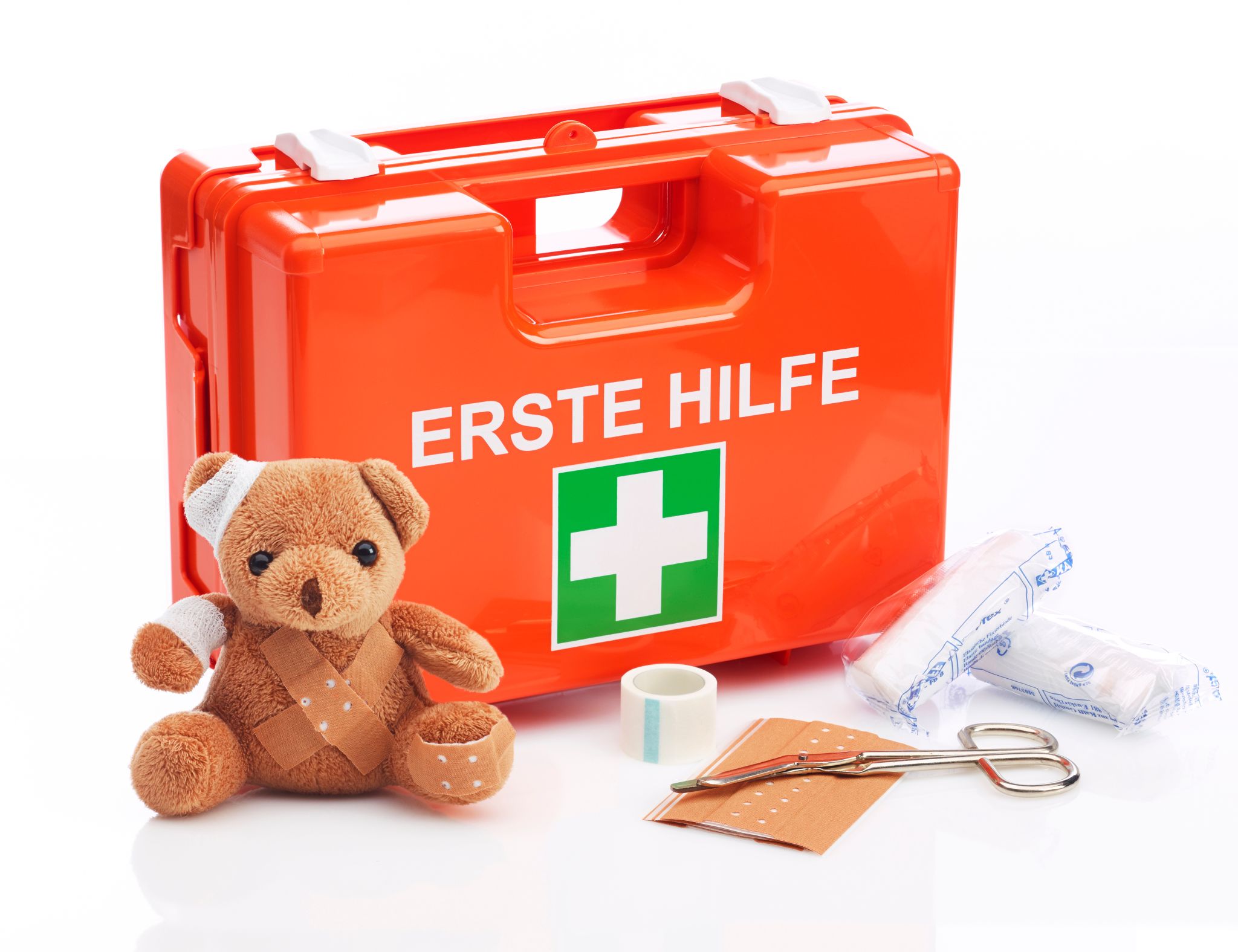 First aid kit with teddy bear and first aid kit as well as bandages such as scissors and adhesive plasters