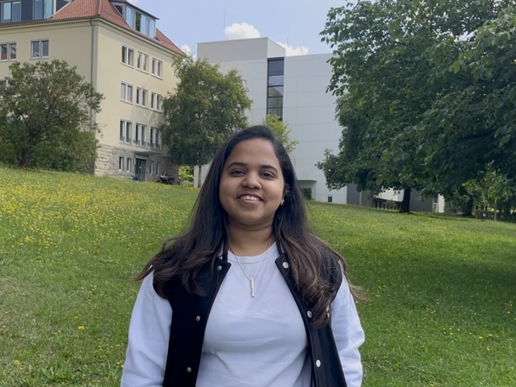 Young woman in a green meadow.