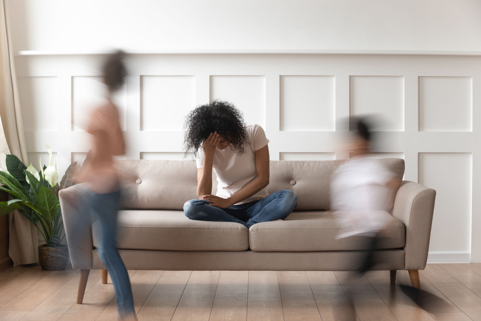 Stressed person on a sofa.