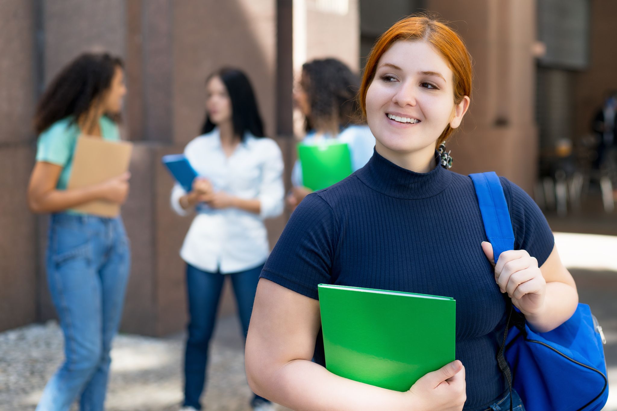 Smiling student with notebook