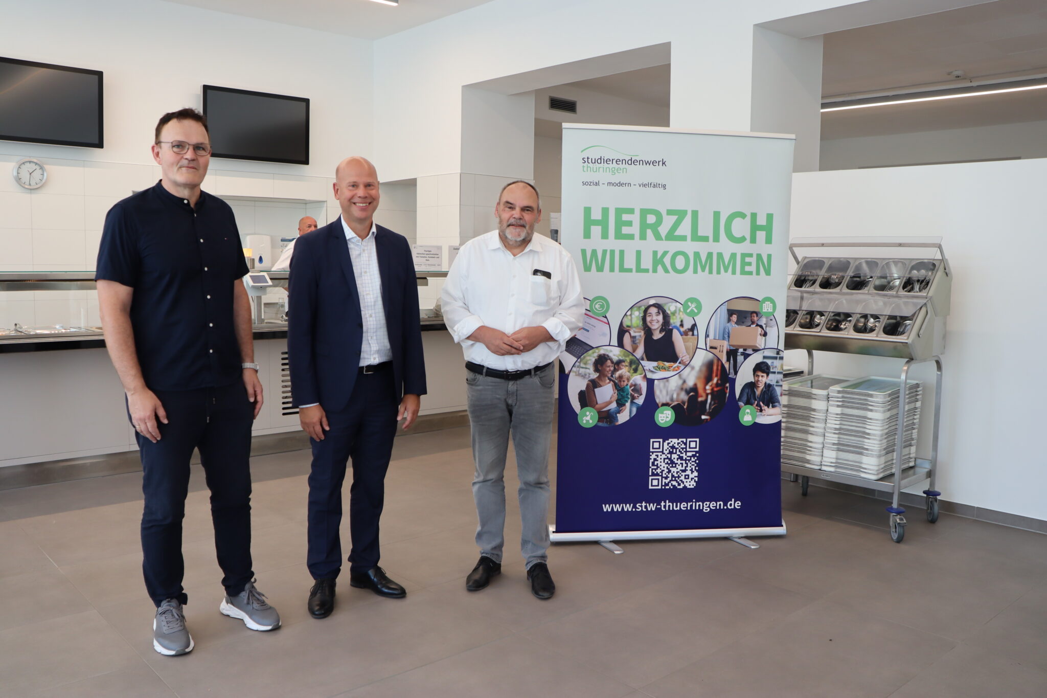 Three men in the new canteen.